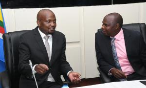 Chief guests, Chief of Staff and Head of Public Service Mr. Felix Kosgey and Cabinet Secretary in the Ministry of Public Service Delivery Mr. Moses Kuria  exchange ideas at the Roadshow